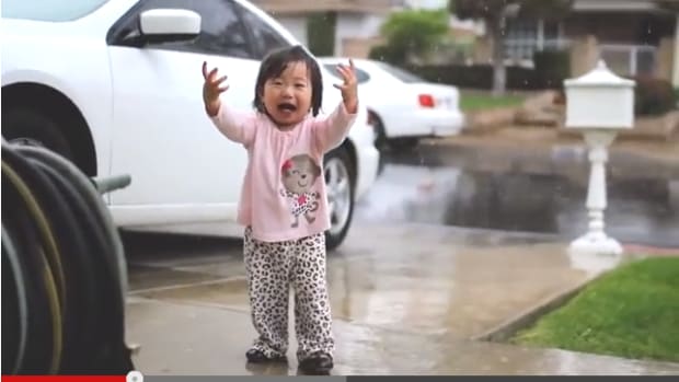 Baby Experiencing Rain for the First Time