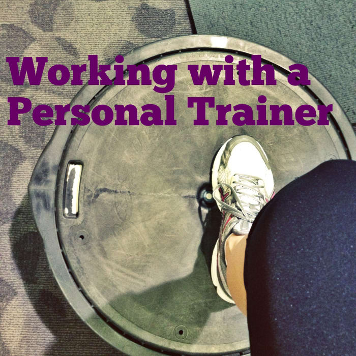 The first thing my trainer taught me was how to get on one of these stupid Bosu Balls. I still look like an unwieldy lunatic on it.