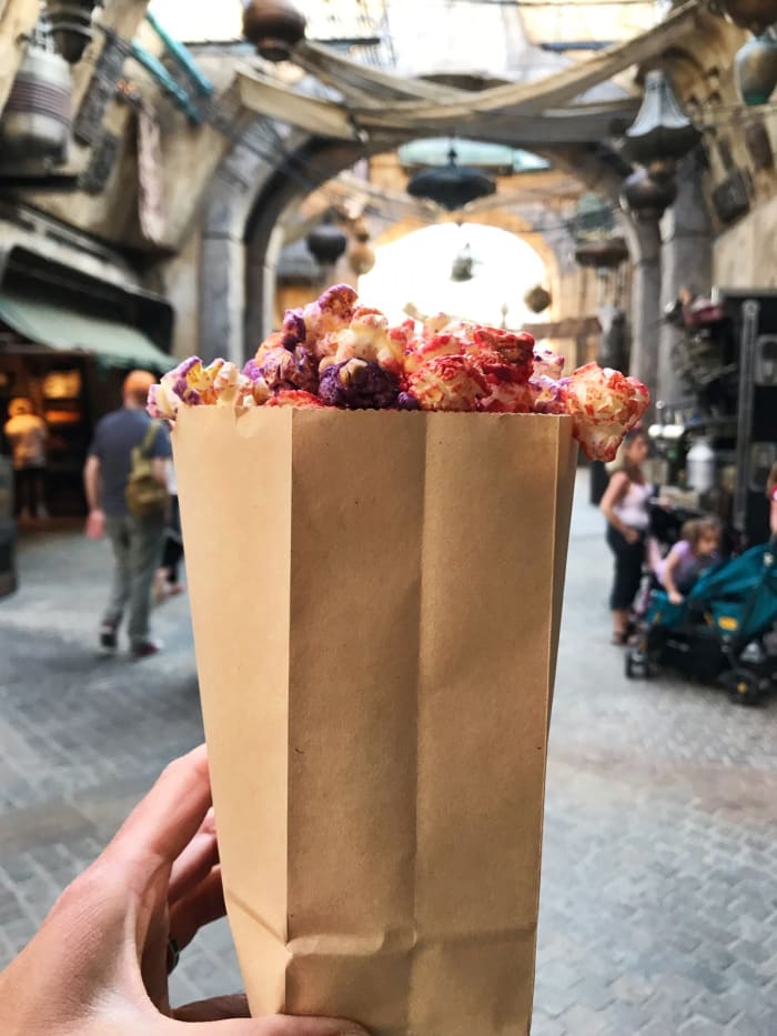 Sweet and spicy. You have to eat the purple and red popcorn together to get the full effect. Don't go cherry-picking just one color.
