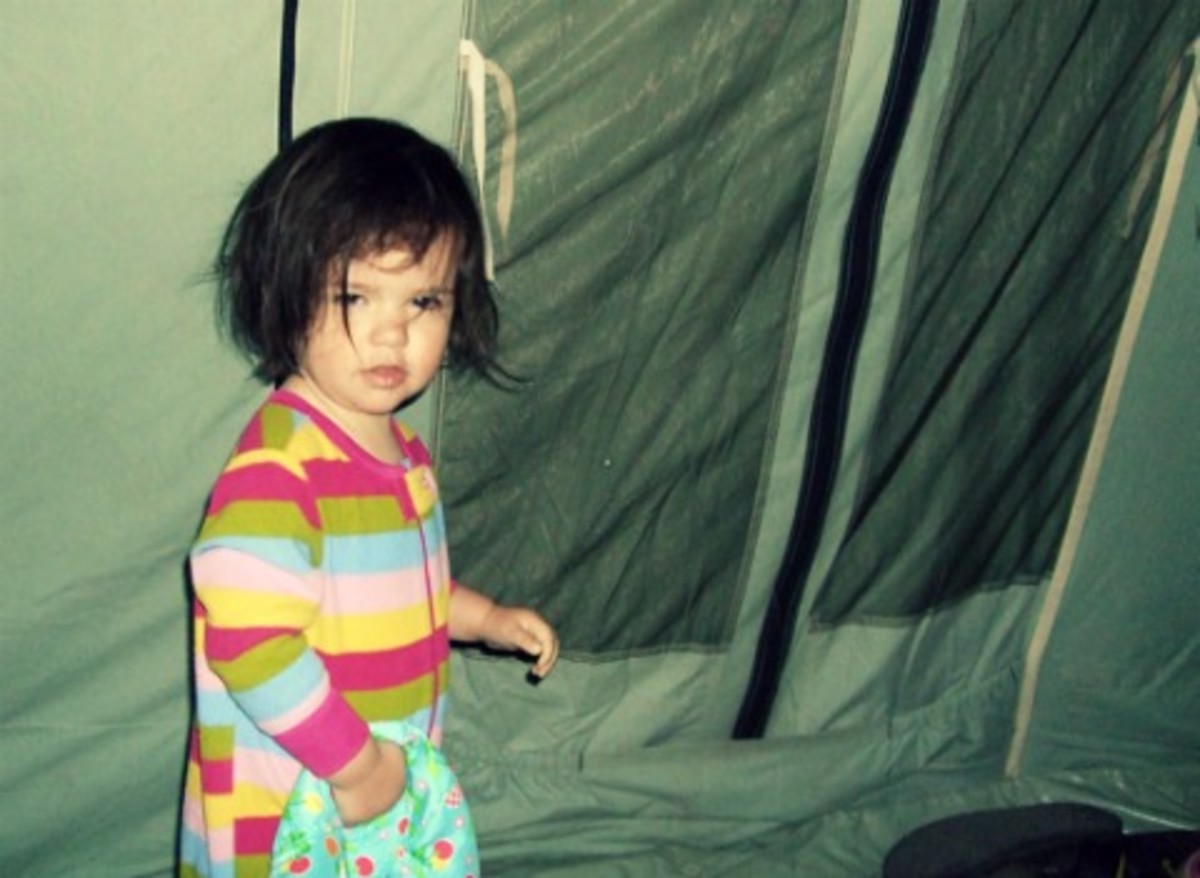 My girl, rocking some SERIOUS bedhead in our Springbar Tent, circa 2009.