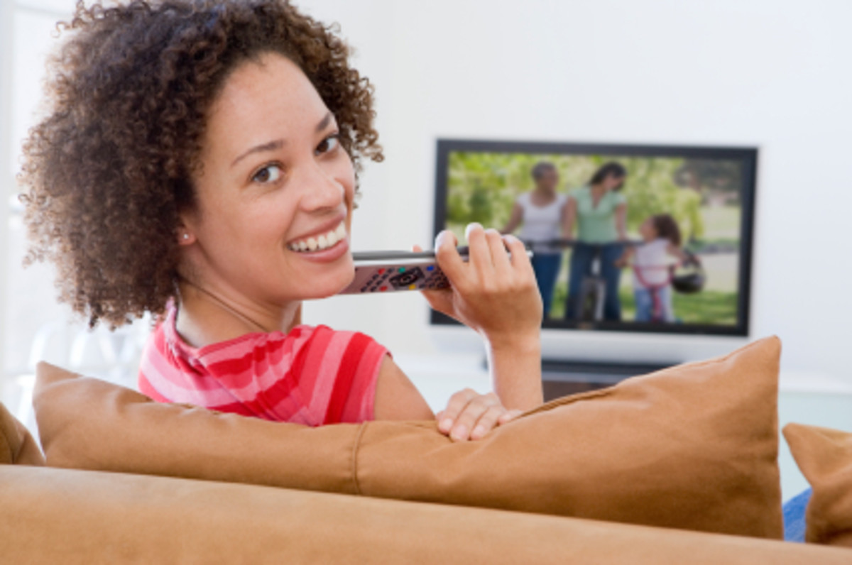 Woman in living room watching television