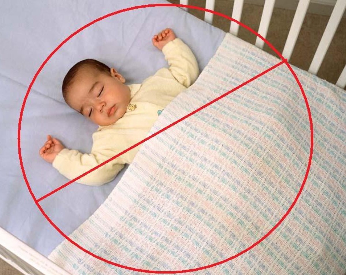 baby sleeps on tummy with face in mattress