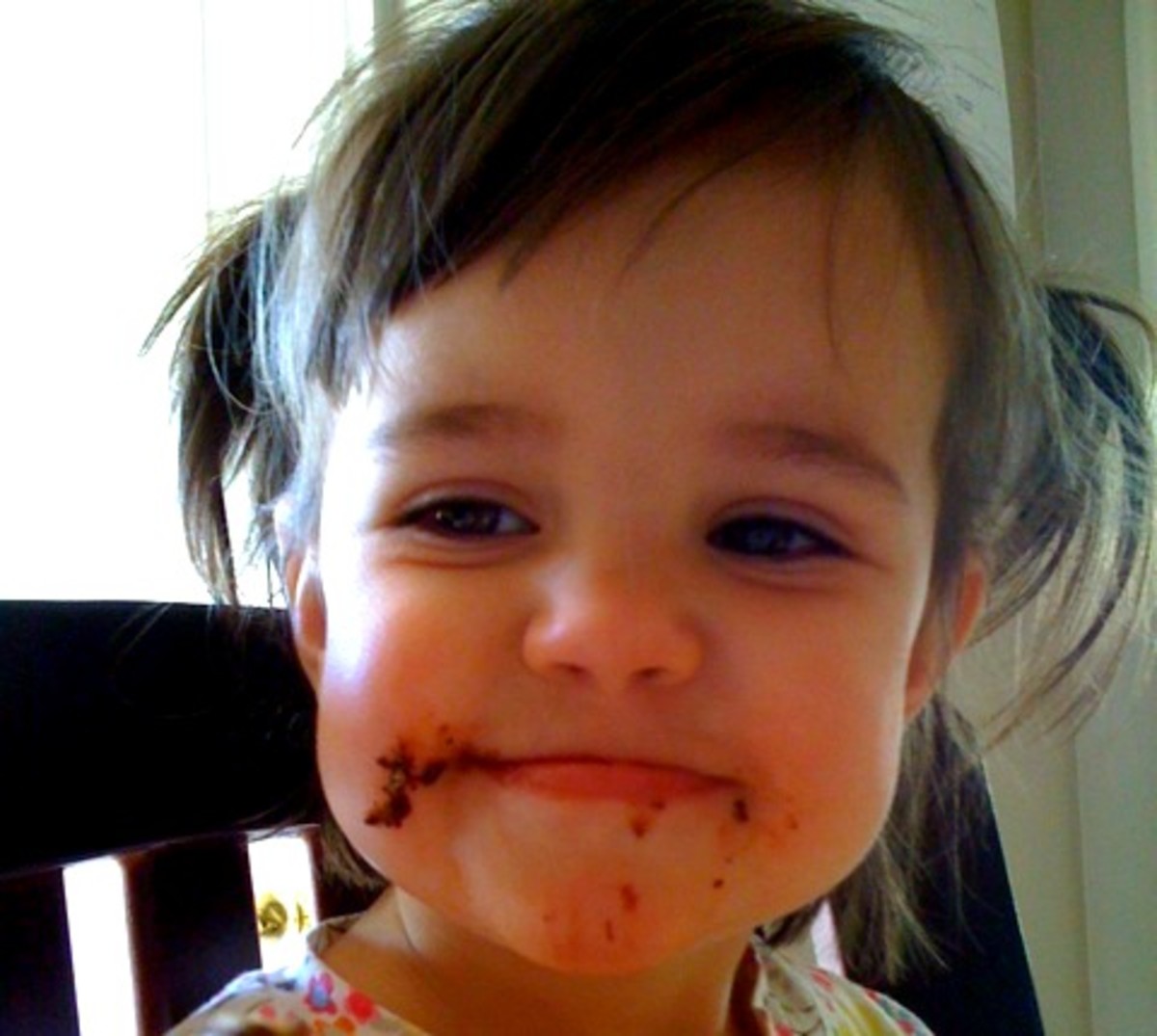 Baby's first cookie face. I posted this on Facebook back in the day, so my family could see that she DOES get treats.