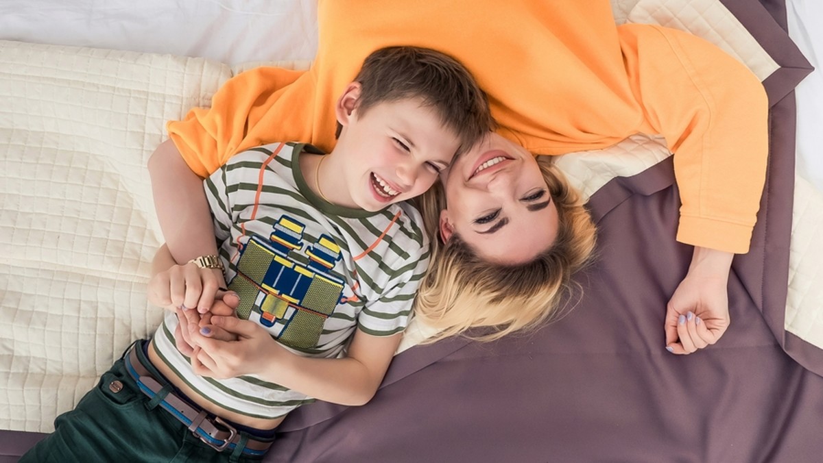 bigstock-Mother-With-Son-On-Bed-Mother-230610379
